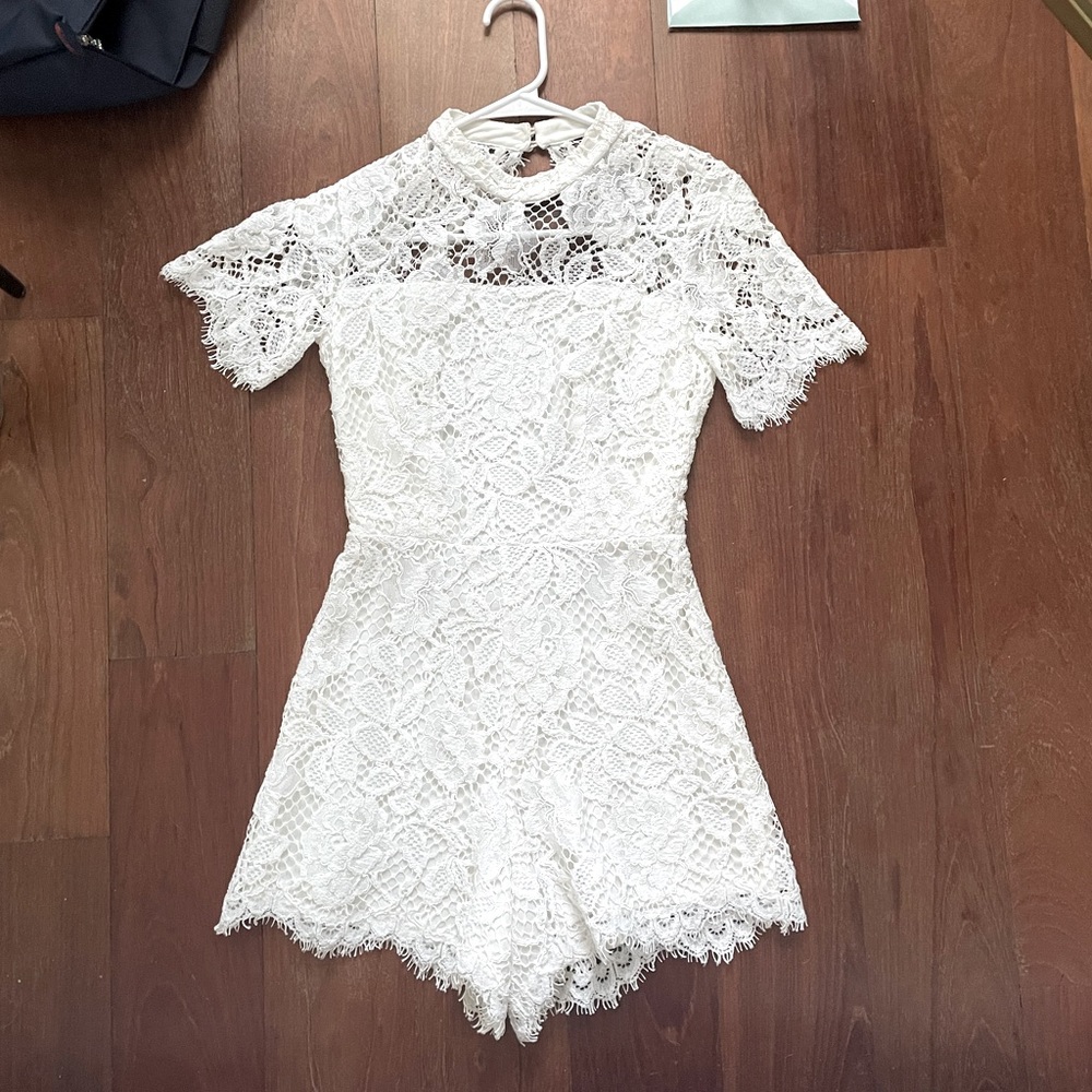 Alexis White lace romper with open back detail
